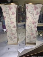 Front view of the pair of square Princeton China vases with floral pattern and gold trim on scalloped rim.