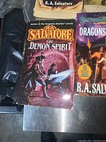 Photo showing R.A. Salvatore's The Demon Spirit with action fantasy cover art