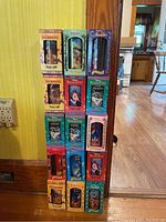 Photo showing 13 Disney collector series cups in original boxed packaging featuring characters from Pocahontas, Aladdin, The Lion King, Peter Pan, Pinocchio, Snow White, and The Hunchback of Notre Dame.