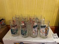 Set of 12 Star Wars Empire Strikes Back glasses arranged on a box showing various character designs and logos