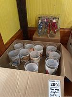 Acrylic Star Wars cups and McDonald's glasses in a box showing general collection.