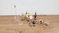 Full wide shot showing all bottles and decor pieces arranged on floor