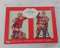 Front of the collectible tin box showing vintage Coca-Cola Santa Claus artwork and limited edition 1994 markings.