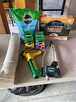 Photo showing a bag of Miracle-Gro Seed Starting Mix, plant food boxes, watering tool, and boxed No-Dig landscape edging.