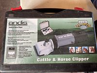 Photo of Andis Cattle & Horse Clipper in original case showing product details