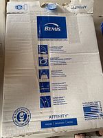 Photo of cardboard packaging of Bemis Affinity round toilet seat showing brand, model features and origin