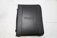 Front view of closed black zip fastening folio case.