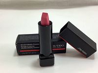 Open lipstick and box showing bullet and packaging.