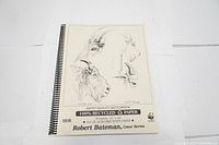 Photo of the sketchbook front cover showing detailed animal sketches and product information.