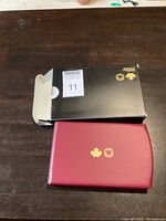 Closed box and presentation case with Canadian Maple Leaf logos and Royal Canadian Mint branding.