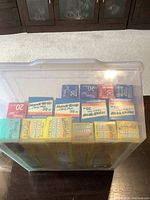 Top-down view of the container filled with assorted wraps and foils all in cardboard boxes.