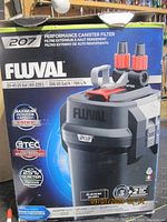 Photo of Fluval Performance 207 canister filter on packaging showing model and capacity for 20-45 US gallons.