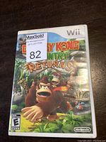 Front cover of Donkey Kong Country Returns game case for Nintendo Wii showing detailed and colorful artwork of characters and jungle.