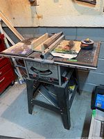 Full side view of the Craftsman 9-inch table saw showing the table surface, fence, and stand.