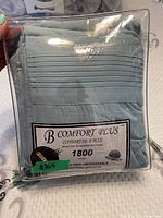 Original packaging of B Comfort Plus 1800 series wrinkle-free king size sheet set in light blue color with label details.