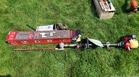 Troy-Bilt Trimmer Plus AH720 assembled on grass with original box