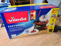Photo of the Vileda EasyWring spin mop and bucket system box showing the brand and product name.