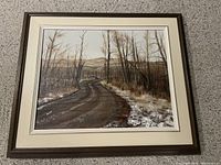 Framed acrylic painting showing landscape with a dirt road, leafless trees, and distant hills, signed Duck