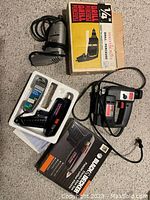 Photo showing all three tools: Mastercraft 1/4" drill with box, Black & Decker glue tool in box, SKIL 4395 saw.