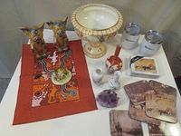 Full view of all items including vases, figurines, tumblers, coasters, mats, amethyst cluster, rose bowl.
