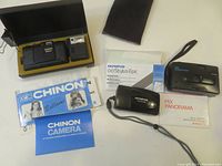 All three cameras with their original manuals, box and receipts