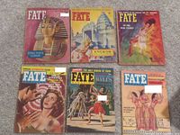 Front covers of six vintage Fate magazines with topics like King Tut's Curse and Angkor temples.