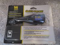 Front view of WEN electric engraver in original blister packaging showing product and packaging details including tungsten carbide tip and adjustable stroke.