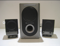 Front view of Altec Lansing 2.1 computer speaker system including two satellite speakers and one subwoofer with visible branding and bass port.