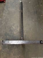 Top-down view of the hitch extension carrier showing the long insertion bar and perpendicular support crossbar.