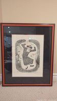 Framed lithograph named "Dancing Rabbi" by Irving Weinstein displayed, view of full artwork in frame.