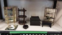 Wide view of all display stands and shelves on table.