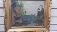 Frontal view of the acrylic landscape painting on board within gilt frame showing overall composition and frame design