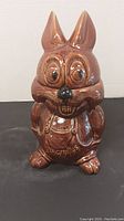Front view of the brown bunny ceramic cookie jar with detailed face and body.