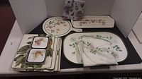 Overview of placemats, coasters, and tablecloth laid out for display