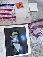 Copy of Constitution packaging showing title and contents including a note indicating the lot contains a copy of the Constitution and a 48 state flag.