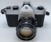 Front view of Asahi Pentax SP 500 camera with attached Super-Takumar 50mm f/1.4 lens, showing lens glass and camera body.