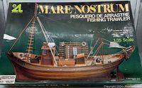 Top of box showing finished fishing trawler model image and brand logo.