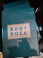 Close-up of the packaging box label showing brand 'Body Rock' and '8LB' weight.