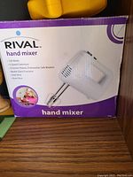 Original box of Rival hand mixer showing product details and image of mixer