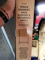 Photo of the packaging label showing dimensions and features of the Calypso single garment rack