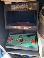Photo of the upright arcade game cabinet 'The Official Zaxxon' showing control panel and marquee.