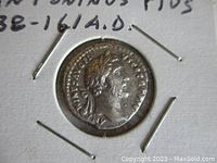 Front side of the silver denarius coin featuring the profile of Antoninus Pius wearing laurel wreath with readable Latin inscriptions.
