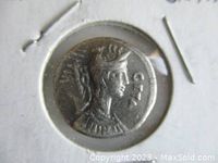 Close-up of obverse side of the silver denarius coin showing the profile portrait of General Gaius Hosidius with inscriptions.