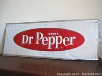 Full front view of Dr Pepper sign showing overall design