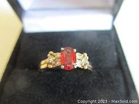 Ring front view in black velvet-lined box