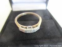 Front view of ring displayed in black box