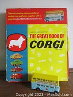 Front view of box with book and bus displayed