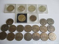 Overview of all coins laid out, including holders and loose coins