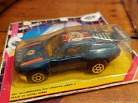 Blue diecast Capri Turbo pull back car in original packaging, size 3.75 inch, with yellow wheels and racing decals.