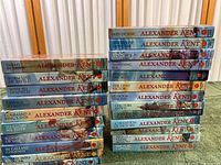 Photo showing 23 Alexander Kent books arranged in two stacks, titles visible on the spines.